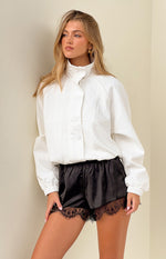 Cream funnel neck sports jacket with crinkled texture fabric, snap button front, and elasticated cuffs and hem