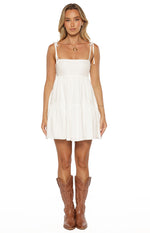 White mini dress with a square neckline, tie-shoulder straps, and a tiered gathered skirt
