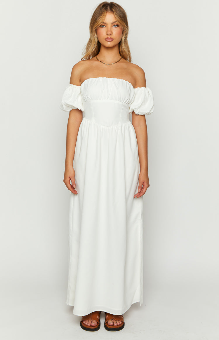 White off-the-shoulder maxi dress with a ruched bust, fitted corset-style bodice, and puff sleeves