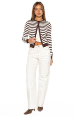 Full length white wide-leg denim jeans with contrast stitching and a raw hem