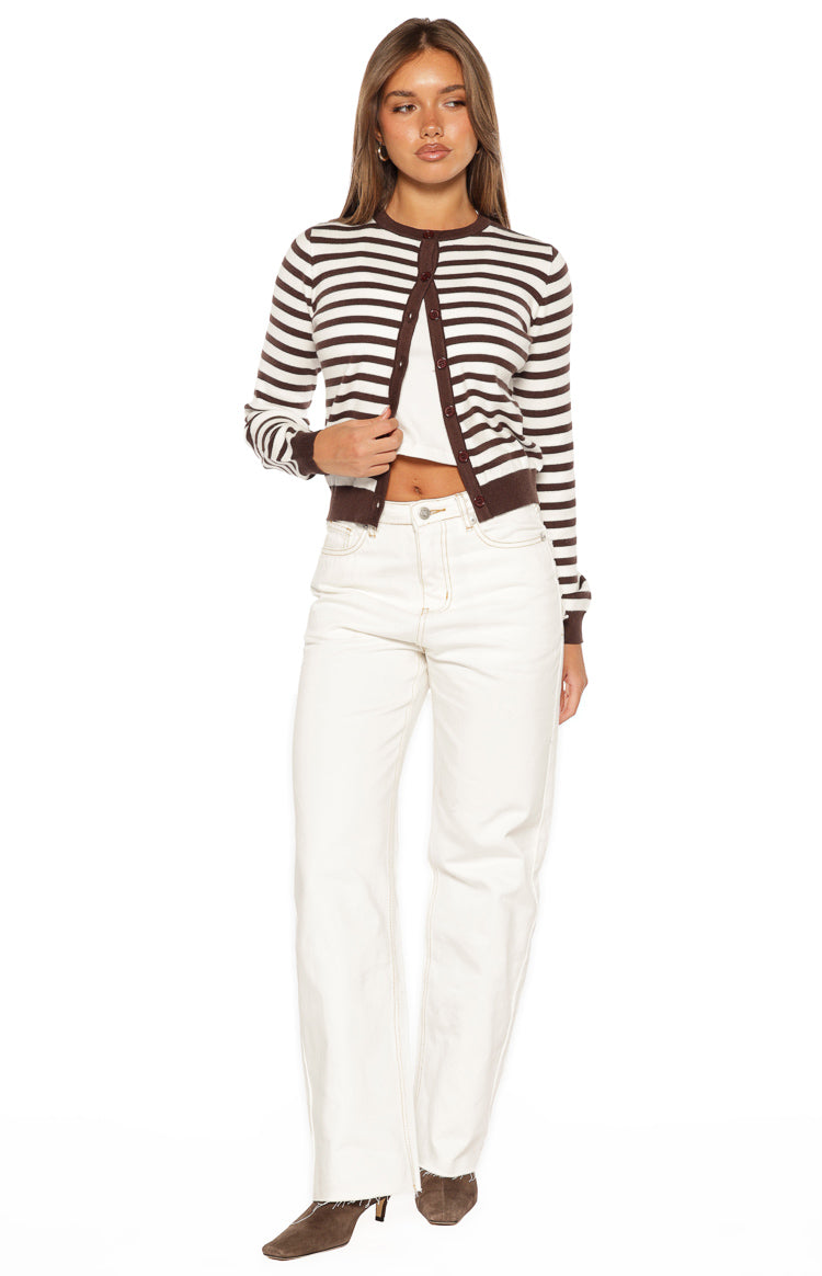 Full length white wide-leg denim jeans with contrast stitching and a raw hem