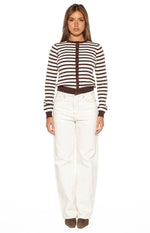 Front view of white wide-leg denim jeans with contrast stitching and a raw hem