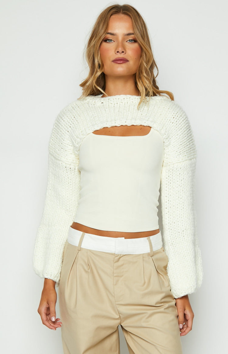 Beginning Boutique Ferla Cream Knit Shrug cream chunky knit shrug with long balloon sleeves and open front