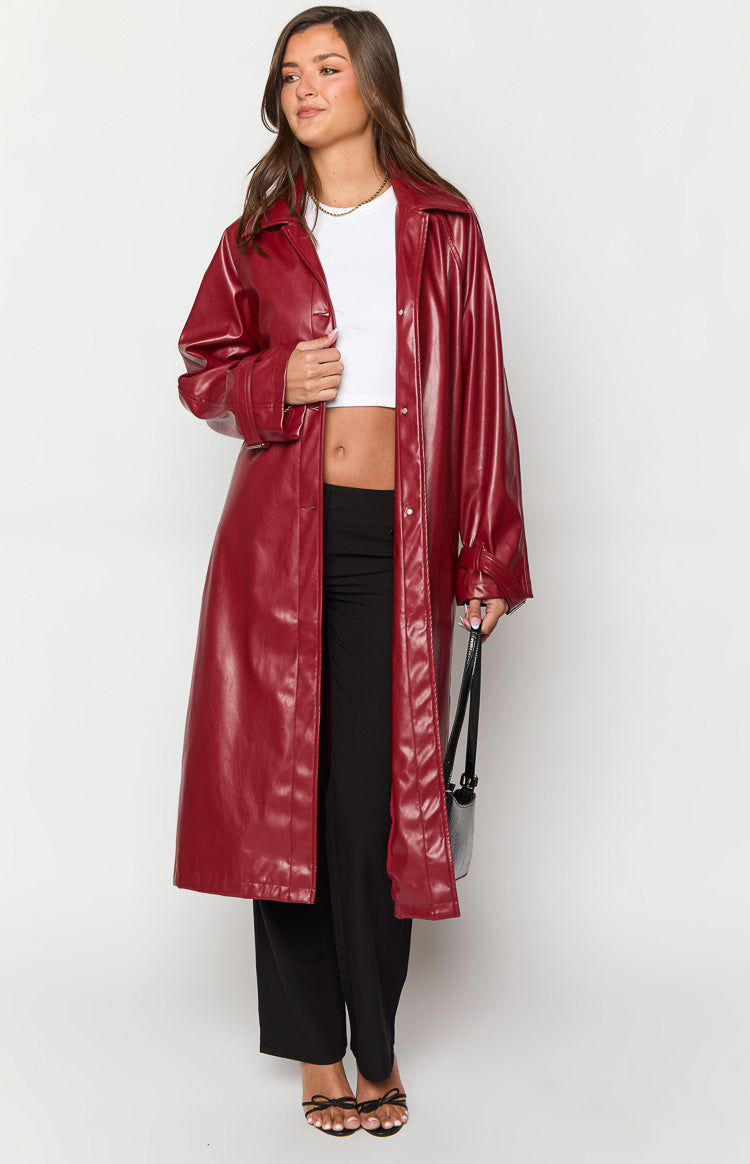 Red PU trench coat with a longline silhouette, open front, and wide lapels