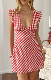 Red gingham mini dress with a deep V-neckline and ruffled cap sleeves