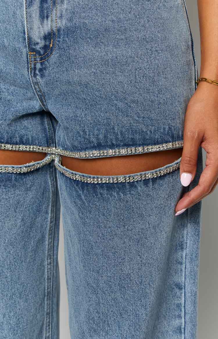 blue denim jeans with thighs slits lined with diamantes 