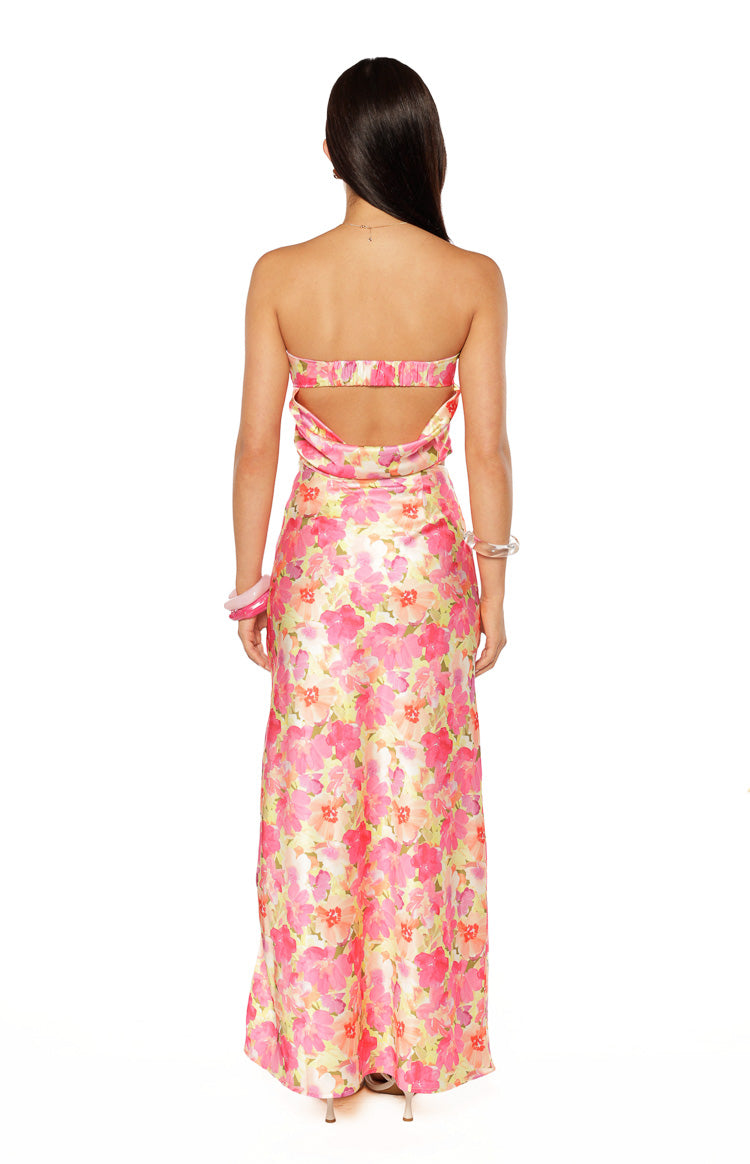 Rear view of the yellow floral pop print strapless top with a band across the upper back and open cut-out