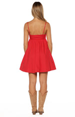 Rear view of a red mini dress with thin adjustable spaghetti straps and a gathered A-line skirt