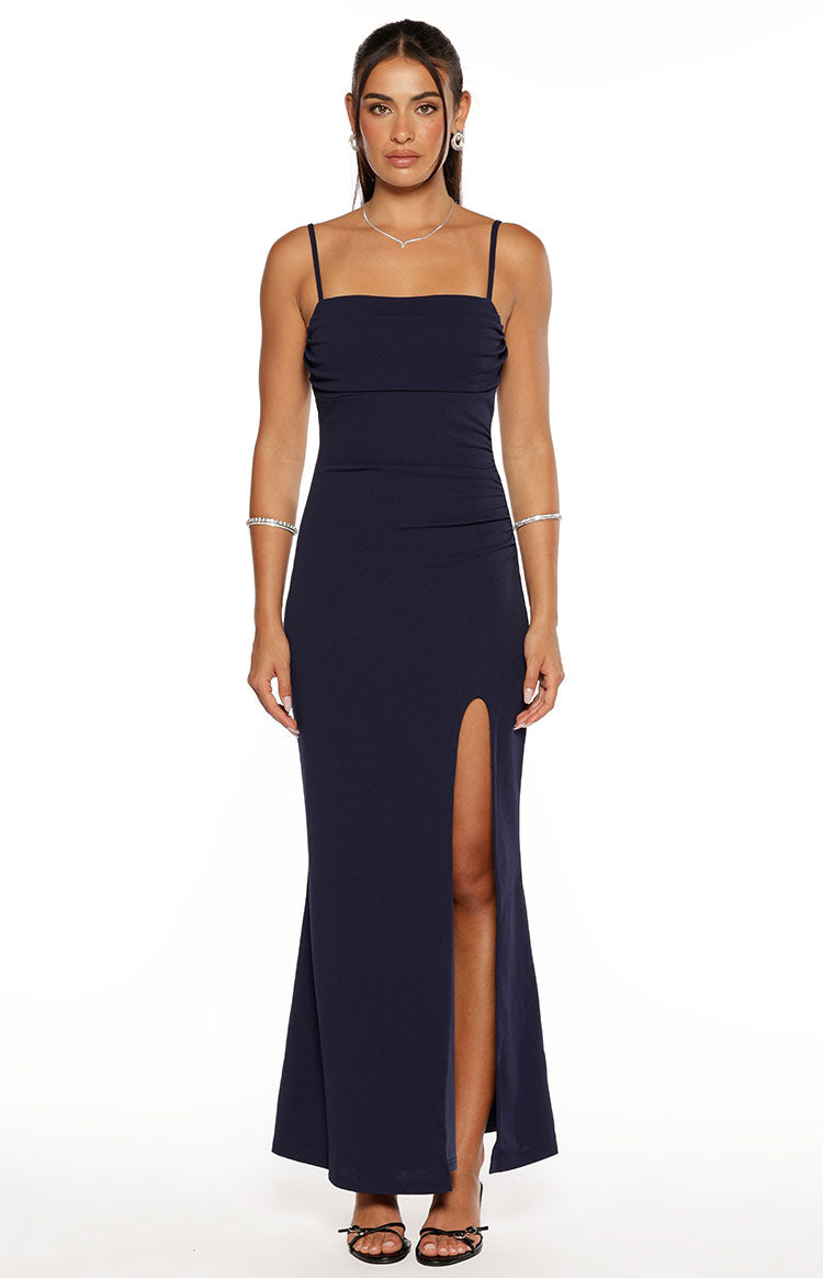 Navy crepe maxi dress with a square neckline, ruched bust, thin spaghetti straps, and a high side slit
