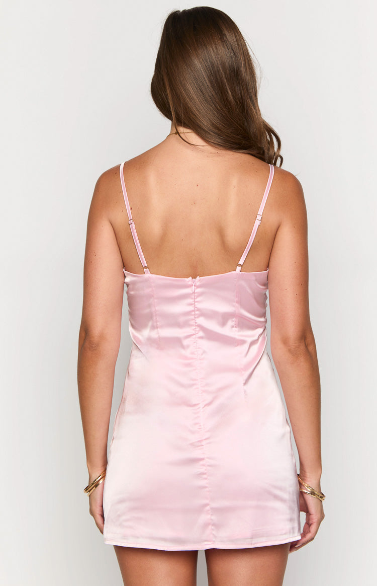 Rear view of a light pink satin mini dress with adjustable spaghetti straps and a visible back zipper