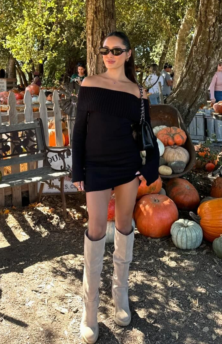 Black long sleeve mini dress with a ribbed off-shoulder neckline and fitted silhouette