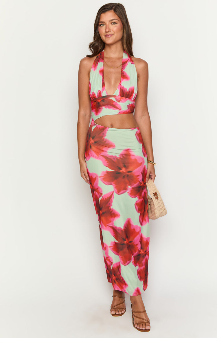 Green floral print maxi dress featuring a halter neck, ruched bust, and midriff cutouts