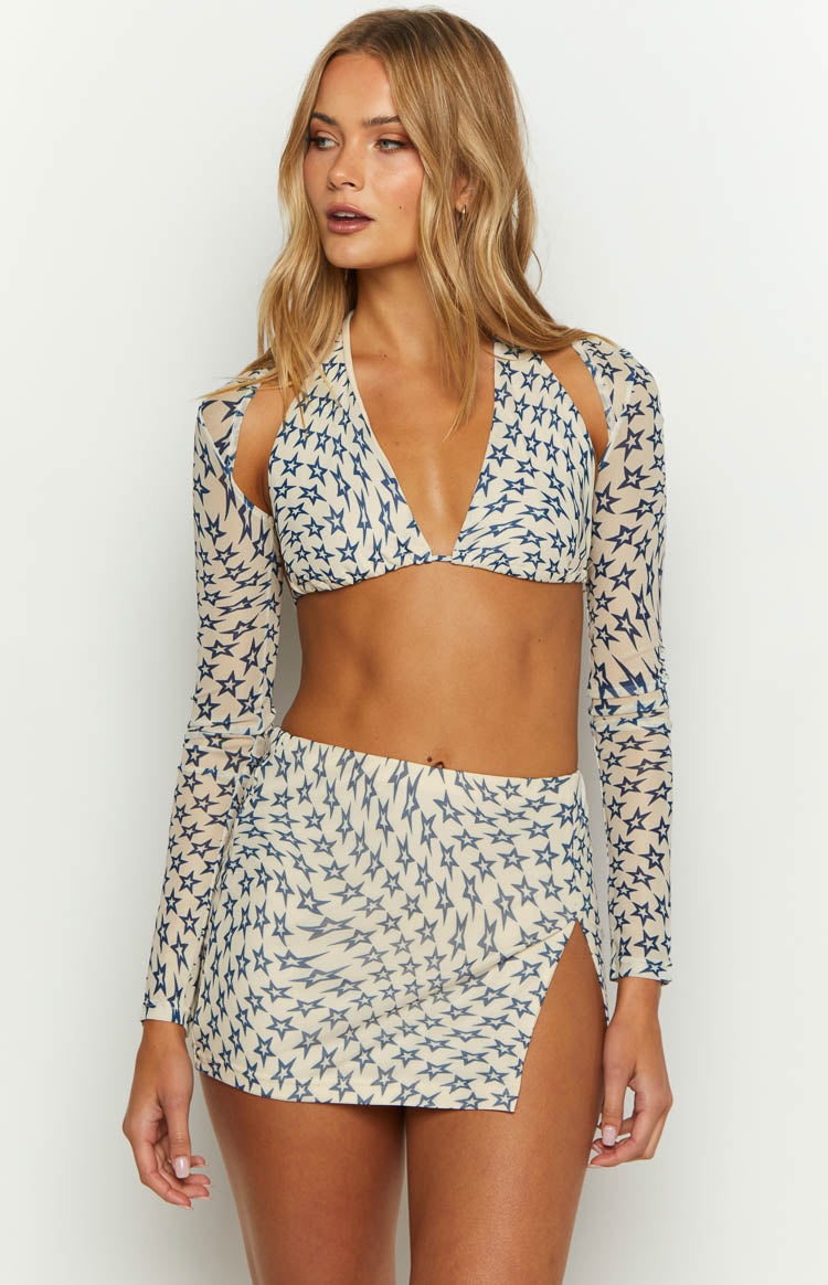 Cream mini skirt with a blue star print and a high side slit