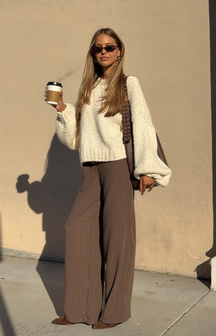 cream chunky knit sweater with voluminous balloon sleeves and a relaxed cropped fit