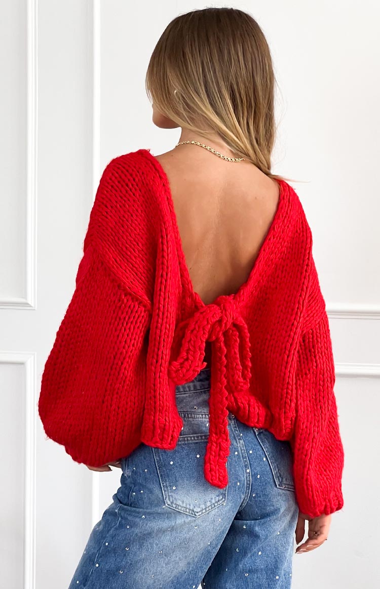 Beginning Boutique Holiday Red Tie Up Knit Cardigan red chunky knit with a deep V-back and tie detail and voluminous sleeves