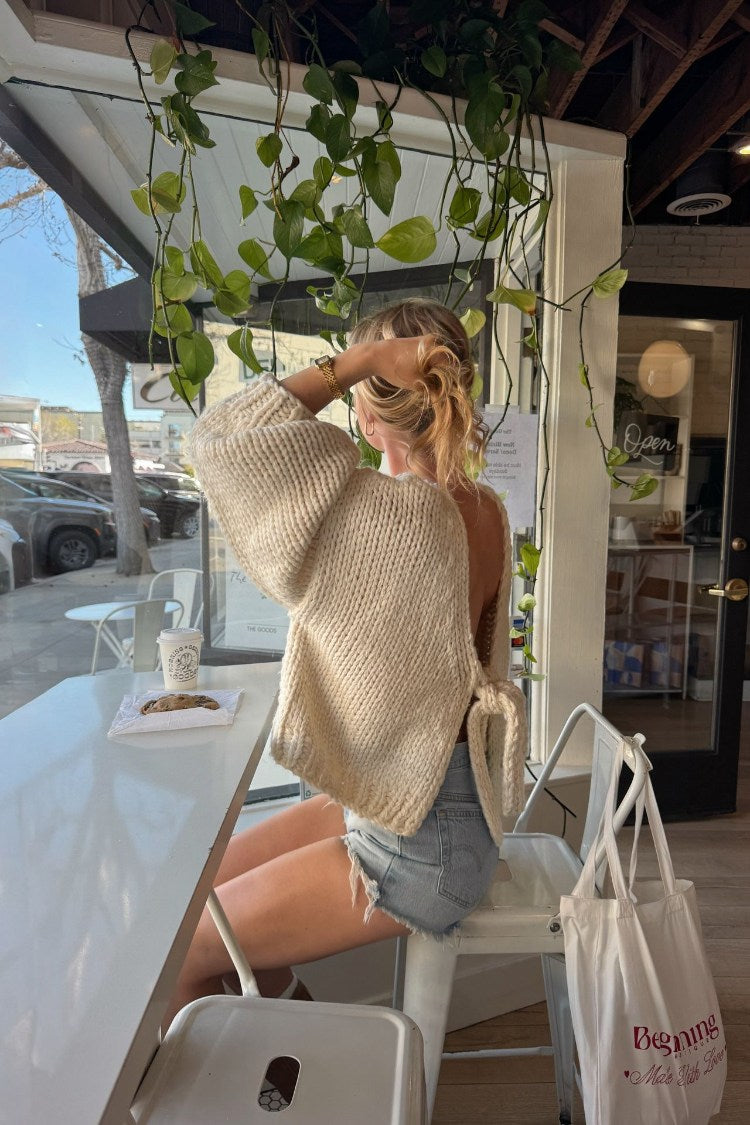 Beginning Boutique Holiday Cream Tie Up Knit Cardigan cream chunky knit oversized cardigan with voluminous sleeves and open t