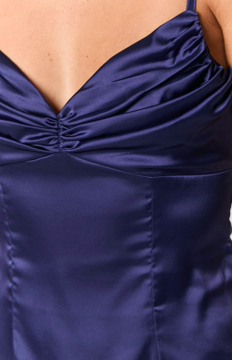 Close-up of the navy satin mini dress bodice with a ruched sweetheart neckline and tailored seaming