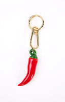 The Hot Stuff Chilli Bag Charm a fun red accessory with a gold clasp perfect for adding a playful touch to your handbag.
