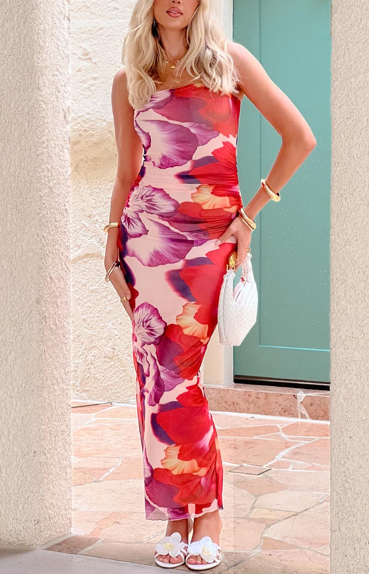 Full length view of a purple and red floral print strapless bodycon maxi dress with side ruching