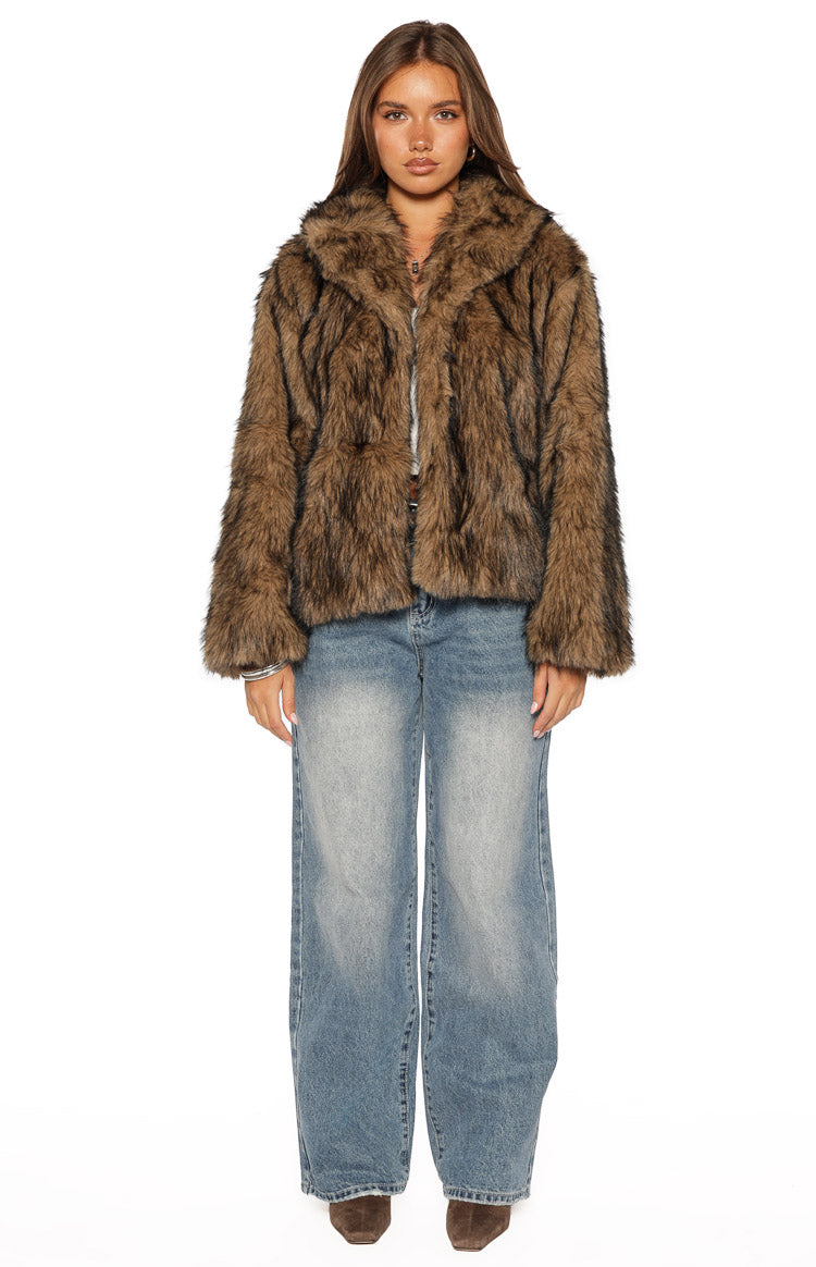 Front view of a chocolate brown faux fur jacket with dark stripes, wide collar, and a slightly cropped fit
