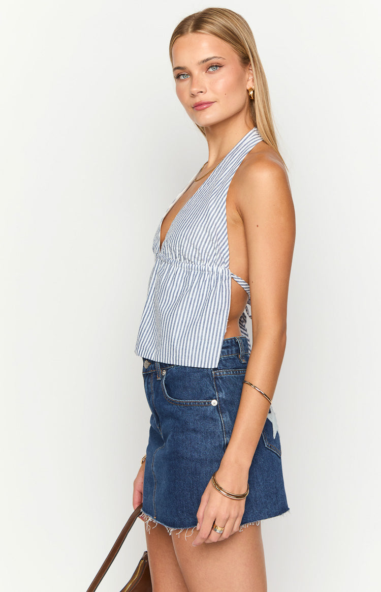 Side view of a navy stripe halter neck top with a deep V-neck and open back tie details