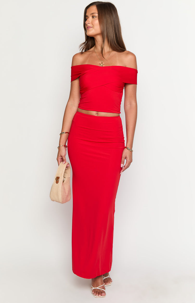 Red maxi skirt with a fitted high waist and straight, floor-length silhouette