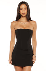 Black strapless crepe mini dress with a fitted bodice and visible corset boning seams
