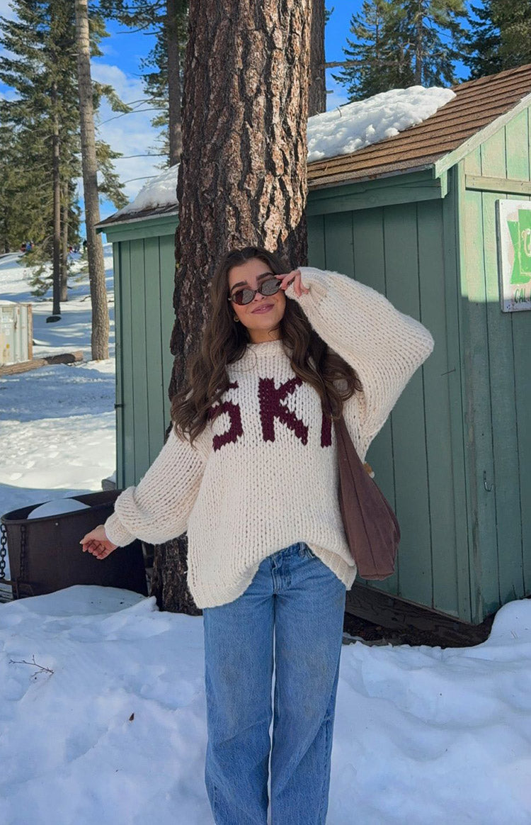 Beginning Boutique Jasmine Ski Cream Jacquard Chunky Knit Sweater cream sweater with burgundy 'SKI' lettering and oversized balloon sleeves