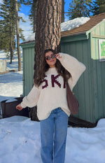 Beginning Boutique Jasmine Ski Cream Jacquard Chunky Knit Sweater cream sweater with burgundy 'SKI' lettering and oversized balloon sleeves