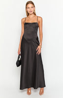 blonde model wearing a black satin formal gown with a lace up corset back detail