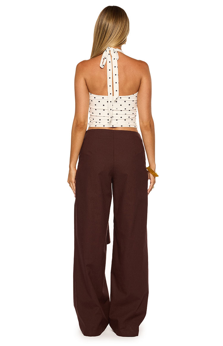 Rear view of brown linen wide leg pants with a relaxed, flowy fit and side tie detail