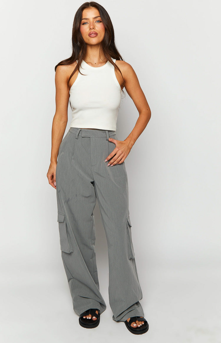 Front view of grey straight leg pants with cargo pockets and pleats at the waist