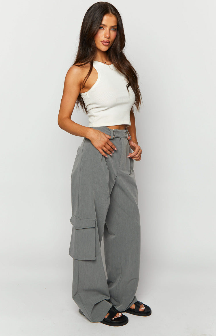 Side view of grey straight leg pants showing the pleated waist and large cargo pocket on the left leg