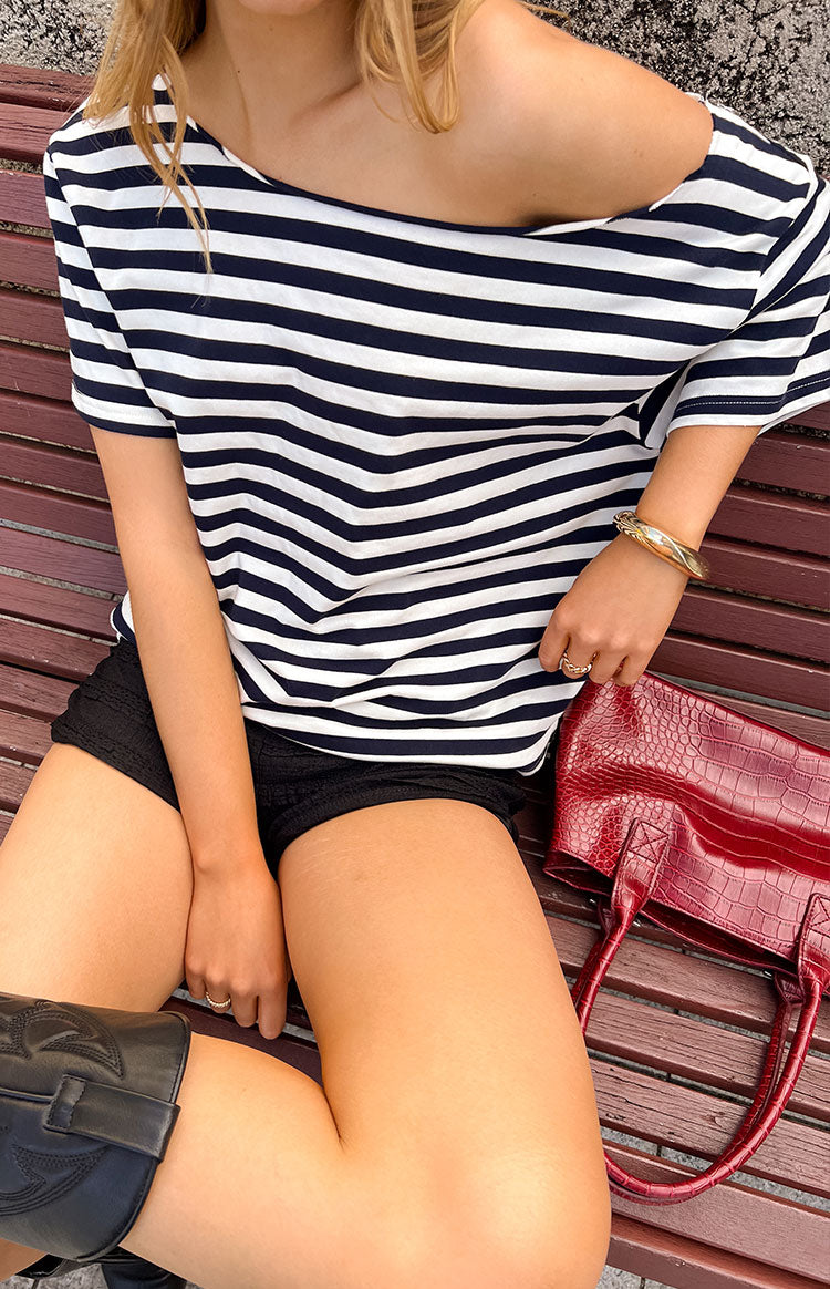 Beginning Boutique Kaiser Navy Stripe Off Shoulder Oversized Top navy and white stripe off-shoulder oversized top with short sleeves