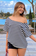 Front view of a navy and white striped off-shoulder oversized top with short sleeves and a relaxed fit