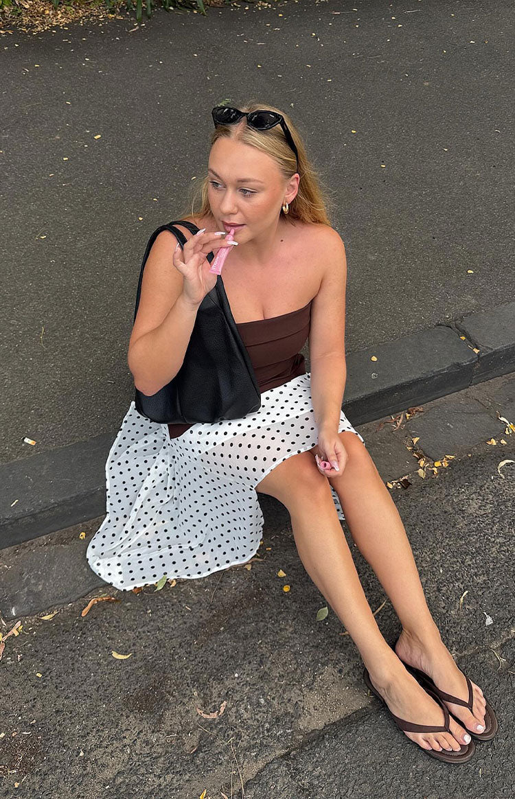 Beginning Boutique Khalea White Polka Dot Hanky Hem Midi Skirt white polka dot flowy hanky hem midi skirt
