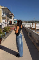 Beginning Boutique Lovers Lane Mid Wash Denim Heart Pocket Slouchy Jeans mid wash denim slouchy jeans with a heart-shaped back pocket and small brand tag