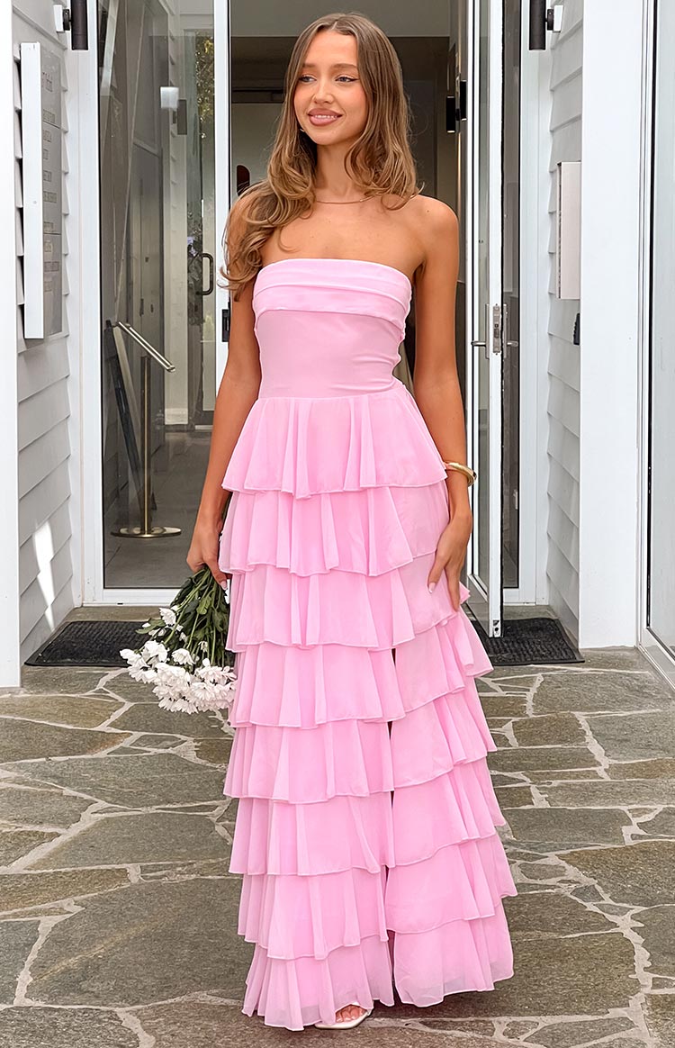 Pink strapless maxi dress with a fitted bodice and full tiered ruffle skirt