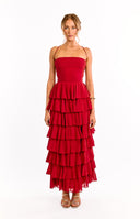 The back of a red strapless formal dress is shown on a girl. This elegant evening dress highlights the gorgeous adjustable ties details across the open back. Perfect for a graduation or black tie event.