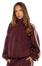 Beginning Boutique Kosie Burgundy and Pink Stripe Track Jacket — burgundy track jacket with high collar, full zip, elasticated hem, and pink double stripes on sleeves