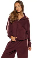 Beginning Boutique Kosie Burgundy and Pink Stripe Track Jacket — burgundy track jacket with high collar, full zip, elasticated hem, and pink double stripes on sleeves
