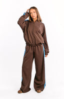 Beginning Boutique Kosie Chocolate And Blue Stripe Track Pants chocolate brown wide-leg track pants with blue side stripes