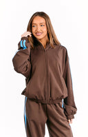 Beginning Boutique Kosie Chocolate And Blue Stripe Jacket chocolate brown zip-up jacket with blue stripes on sleeves, high neck, and ribbed hem