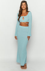 Light blue long sleeve knit top with a square neckline, keyhole cutout, and wrap-around waist straps