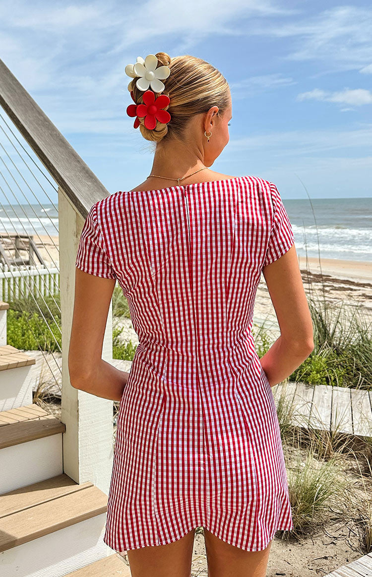 Rear view of a red gingham mini dress with a square back neckline and short puff sleeves