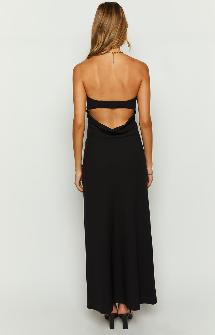 Back view of a black strapless maxi dress with an elasticated upper band and side waist cutouts