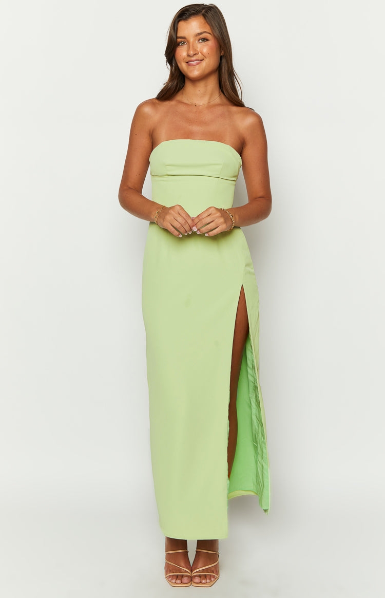 Front view of a lime green strapless maxi dress with a fitted bodice and a high left side slit