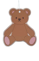 teddy bear shaped car air freshener hanging from rear view mirror