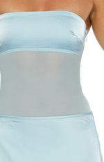 Close-up of the light blue strapless satin bodice with a sheer mesh midriff panel and a side zipper