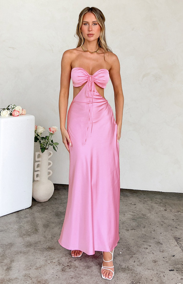 Beginning Boutique Lili Pink Satin Strapless Maxi Dress pink satin strapless maxi dress with a bow front and waist cutouts